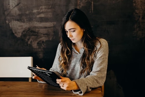 Woman checking scheduling calendar 