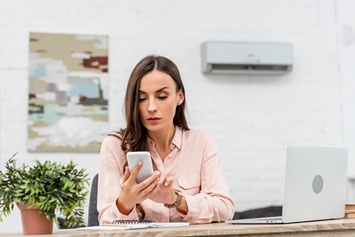 Women looking up how to conduct verification of employment