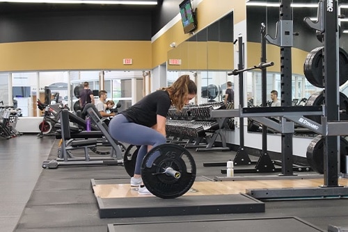 Woman lifting at a gym