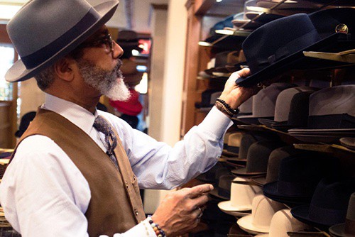 Man working at a hat store 