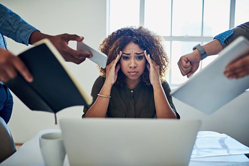 Woman over whelmed with employee communication