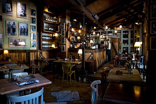 restaurant manager in an empty cafe, creating a schedule