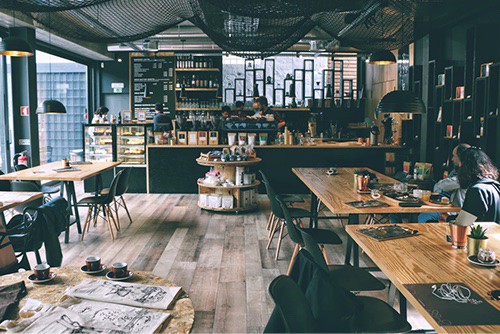 workers and customers at a coffee shop