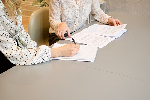 Woman filling out employee documents
