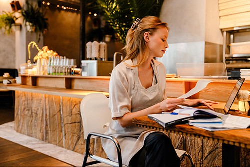 Woman looking at Sample bakery business plan