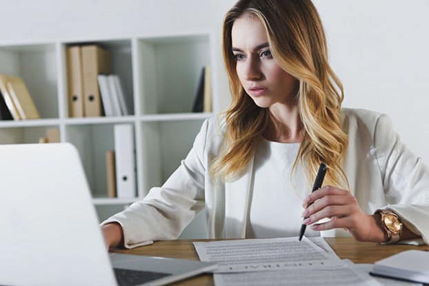 Woman using staff scheduling software